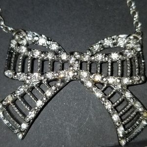 Rhinestone bow necklace. Silver tone
